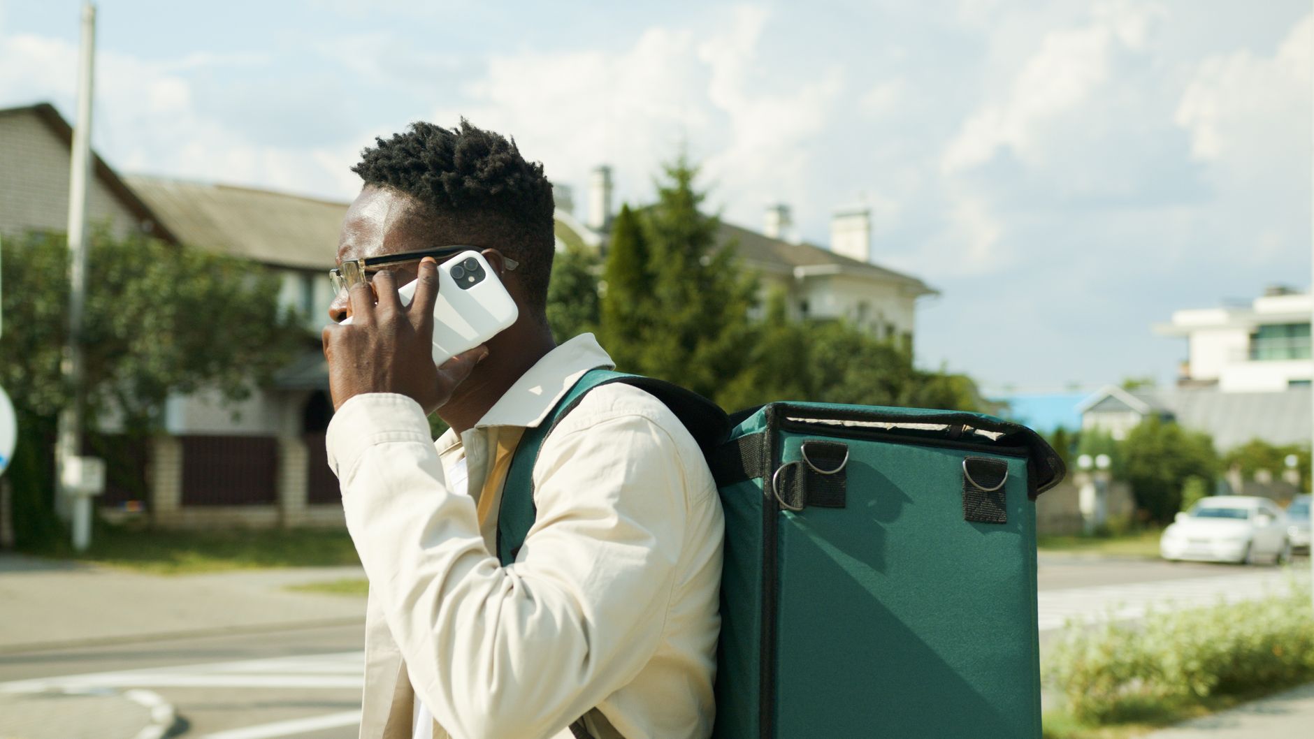 Person handling a delivery call on a smartphone