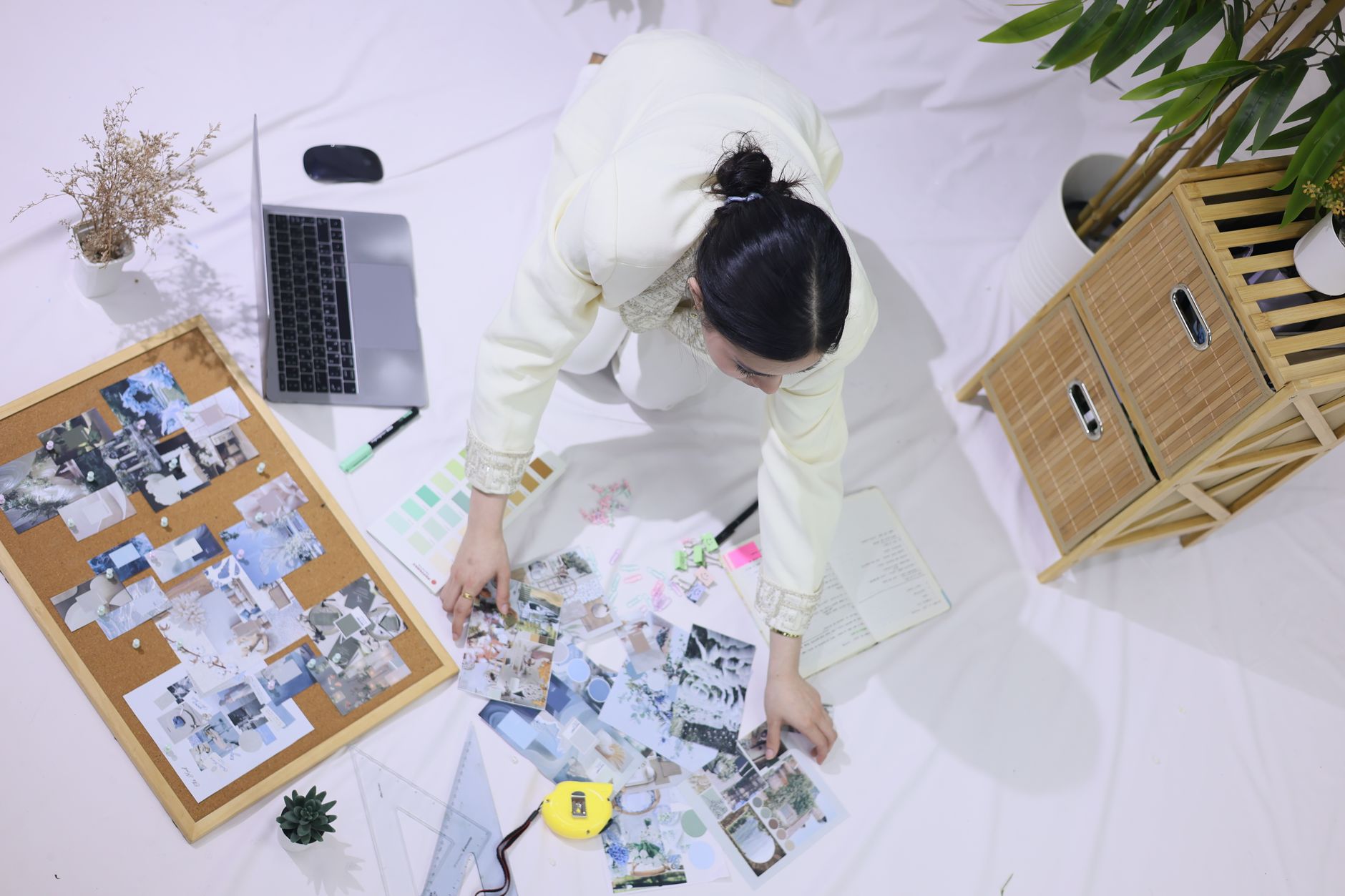 A desk with a mood board and working materials.