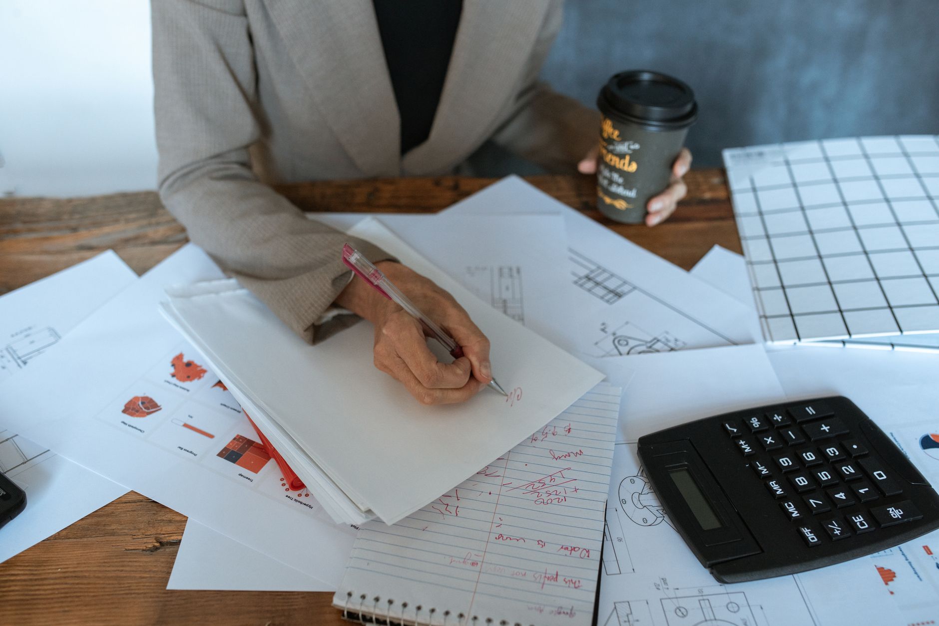 A stopwatch and printed documents on an office desk