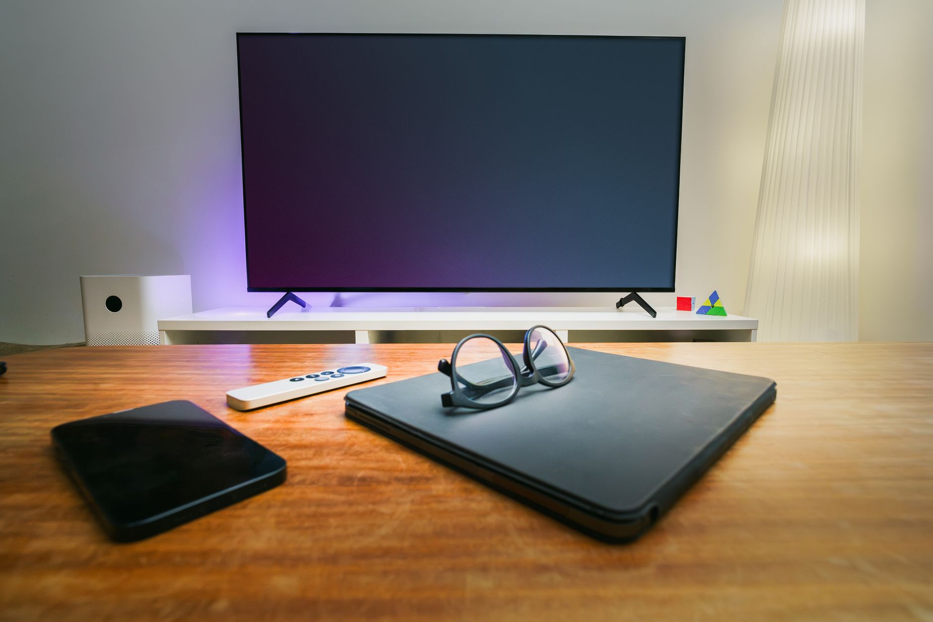 Smart glasses beside a phone