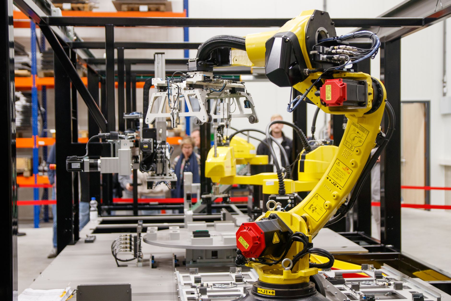 Robot arm reaching toward a cabinet door