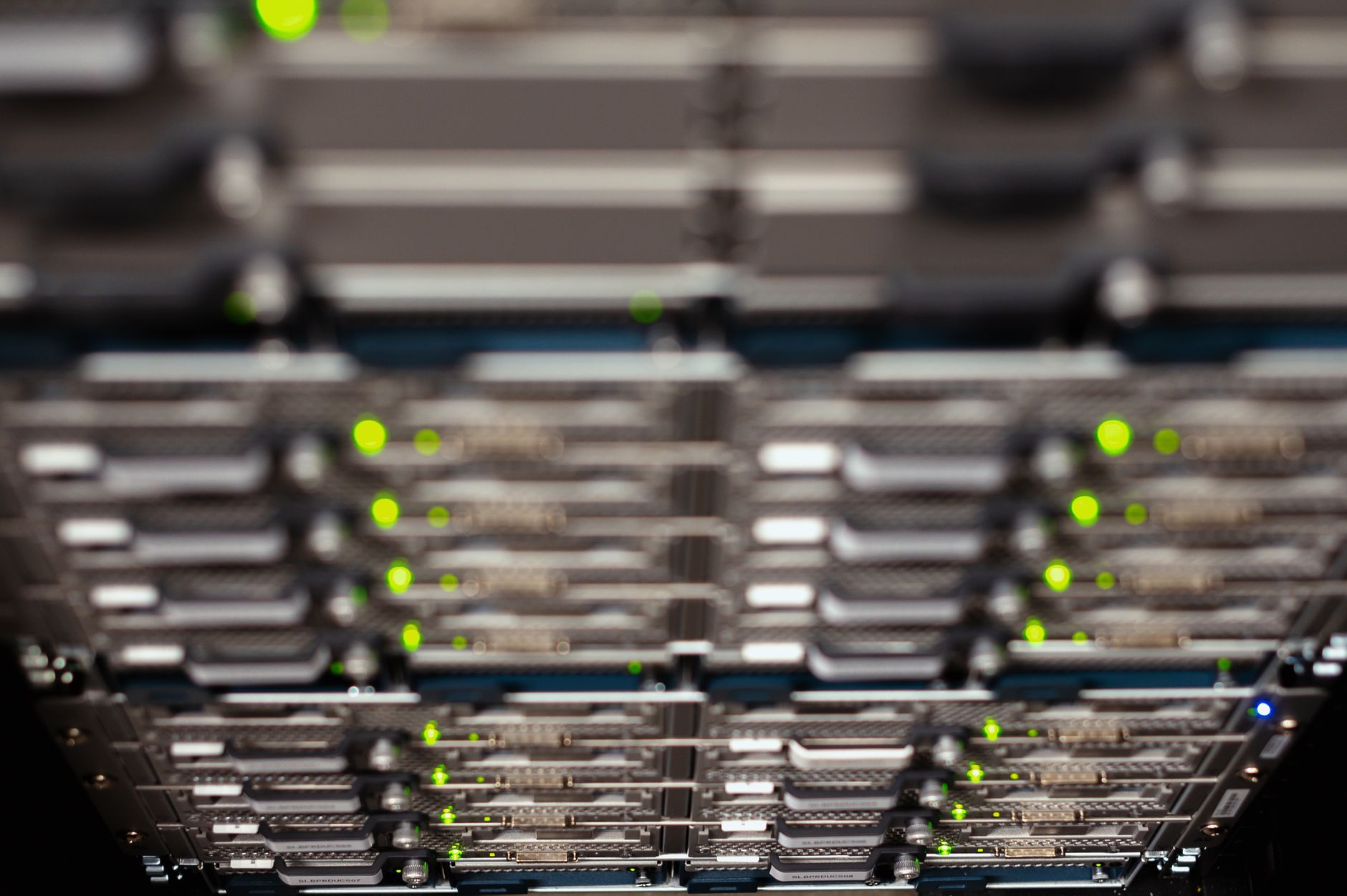 Illuminated hardware server racks operating inside a modern data center